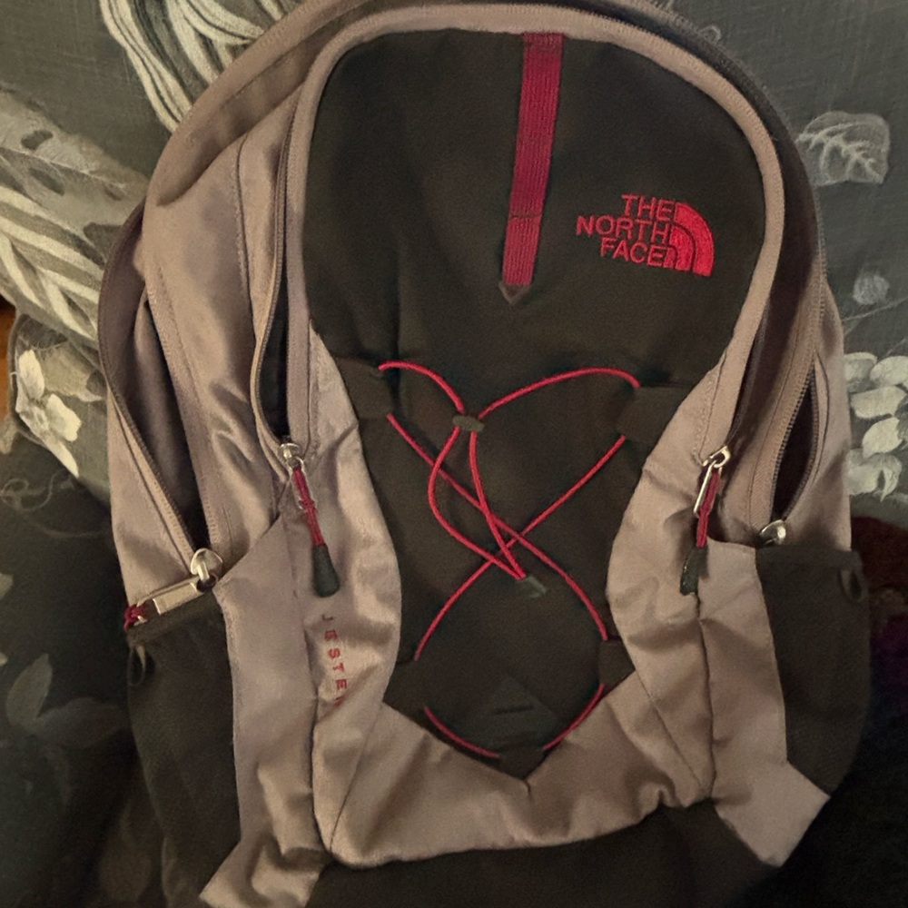 The North Face Black and Red Backpack with Sleek Design